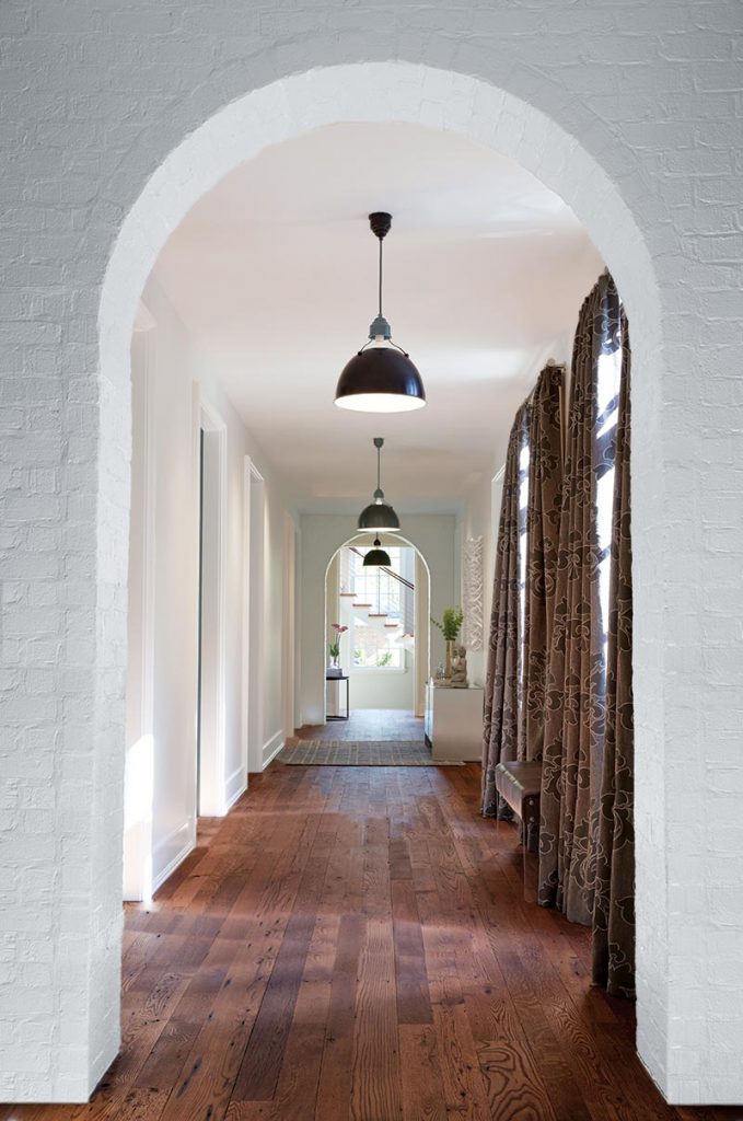 A series of brick archways defines the gallery hallway.