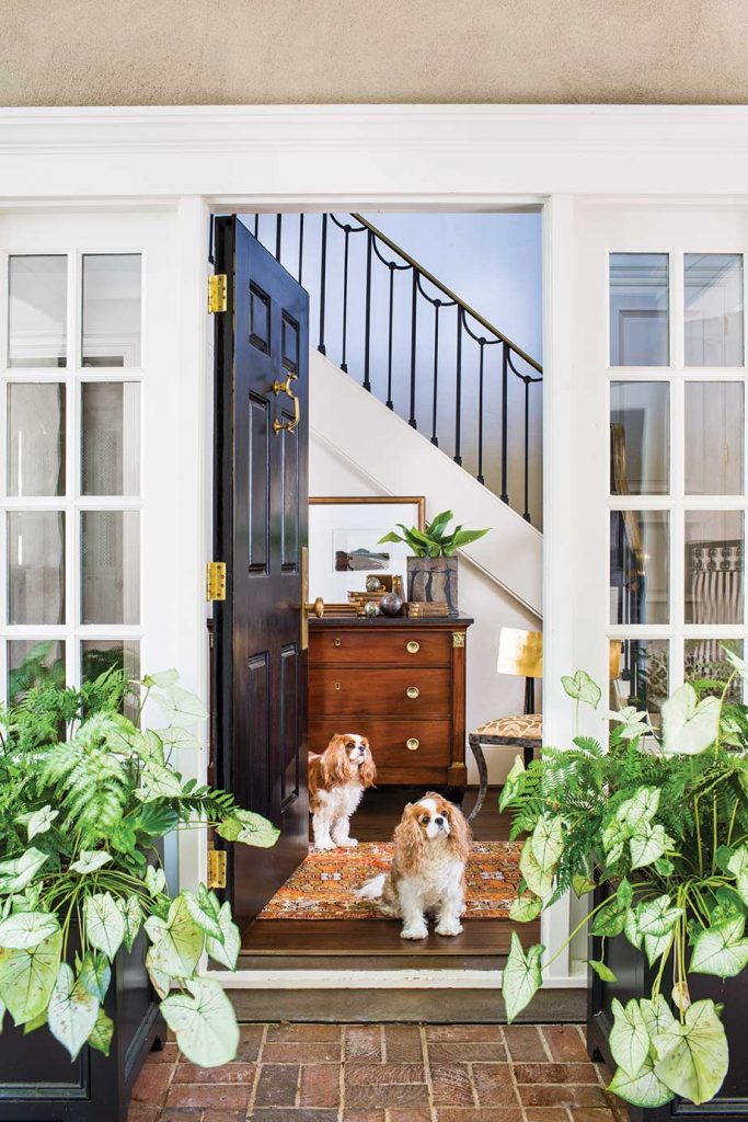 Tank and Lucy greet guests into the main entrance of the house which is on the side in typical Charleston style.