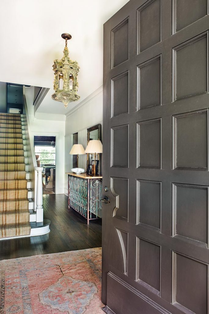 An Oushak rug creates a warm welcome in the entry hall.