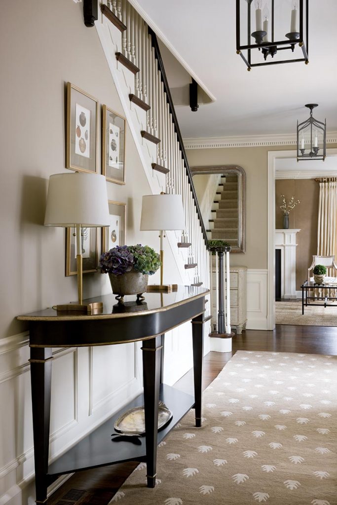 The gracious front hall is thoughtfully decorated with antiques and reproductions.