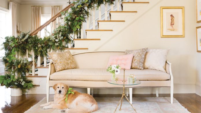 Holiday Elegance Meets Family Charm in This Arkansas Home golden retriever and Christmas stairwell
