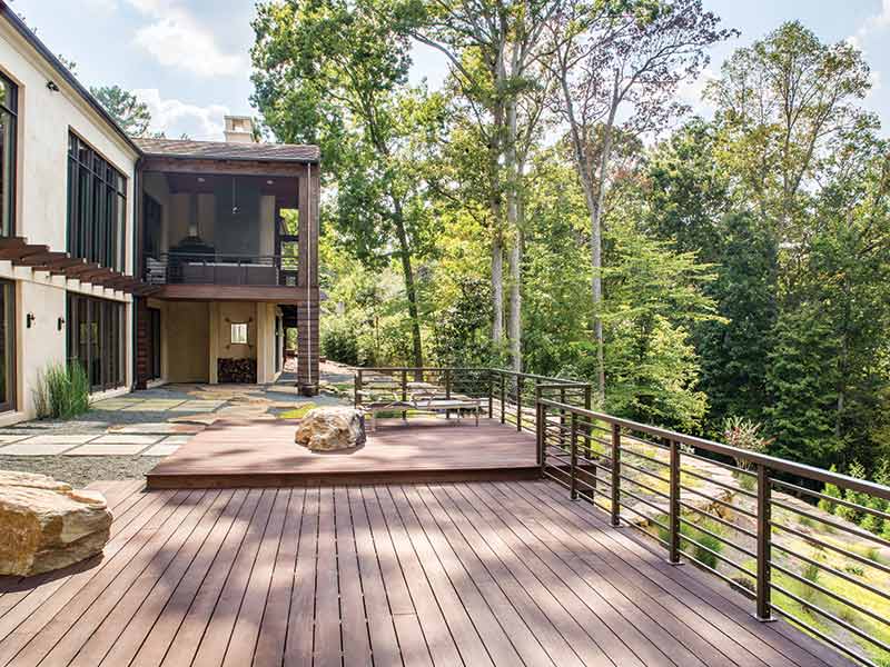 Modern back patio with a tree-top view