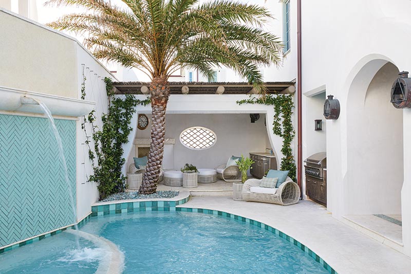  Pool with palm tree and lounge chairs. 