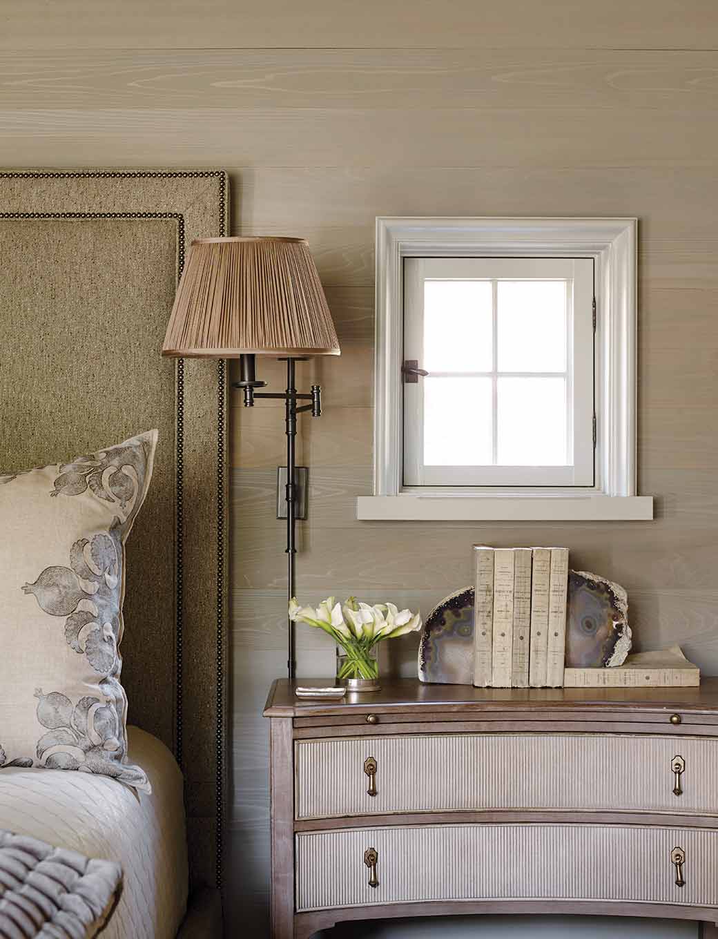 Small pane window above bedside table