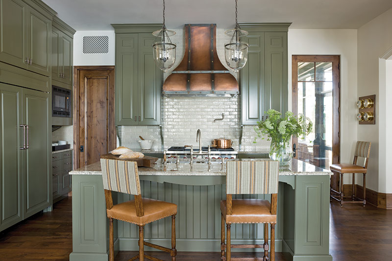 sage green cabinets in rustic kitchen