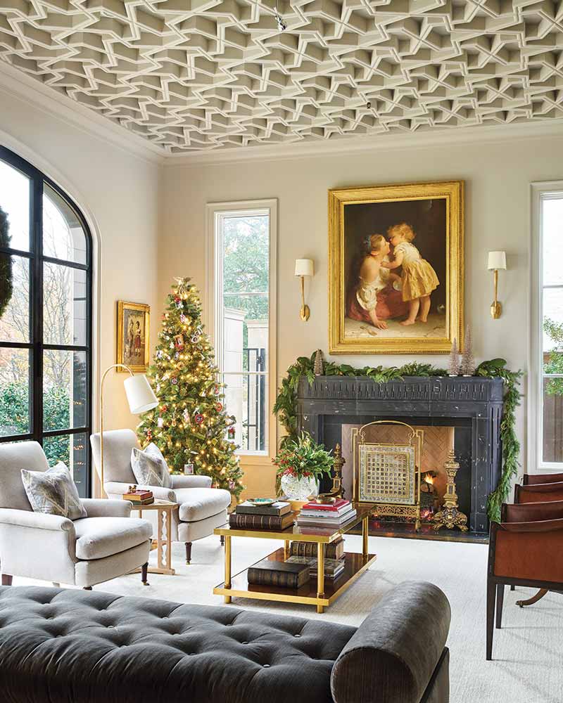 grand living room with fireplace and Christmas tree