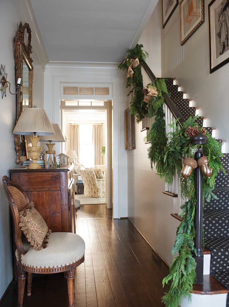foyer with green garland