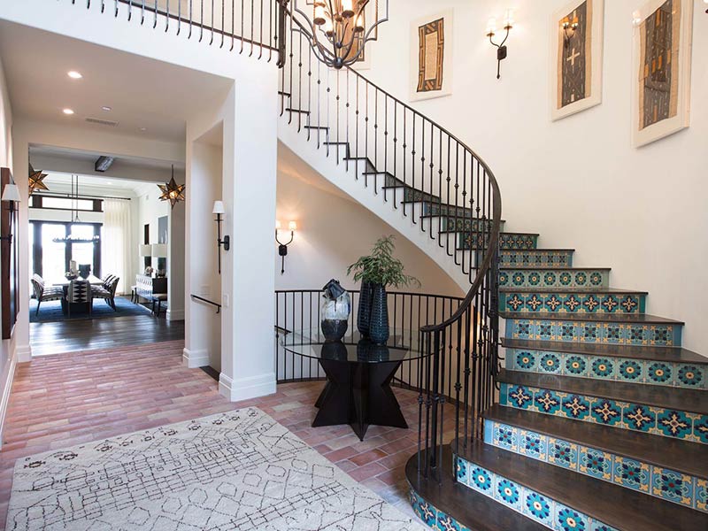 Spanish Colonial style foyer with tiled stairs