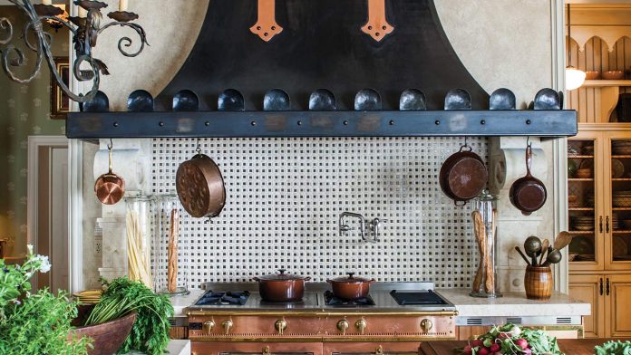 This La Cornue Range Is Right at Home in An Exquisite French-Style Chateau bronze and copper La Cornue range