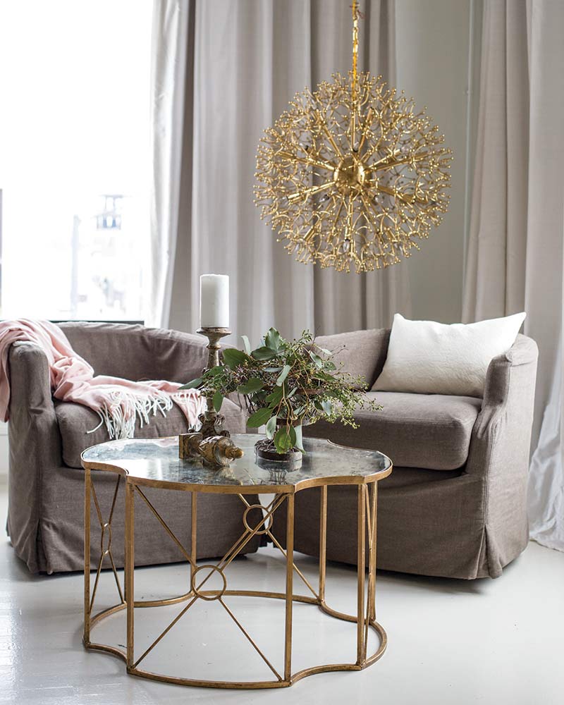 chandelier with curvaceous wire structures tipped with tiny globes