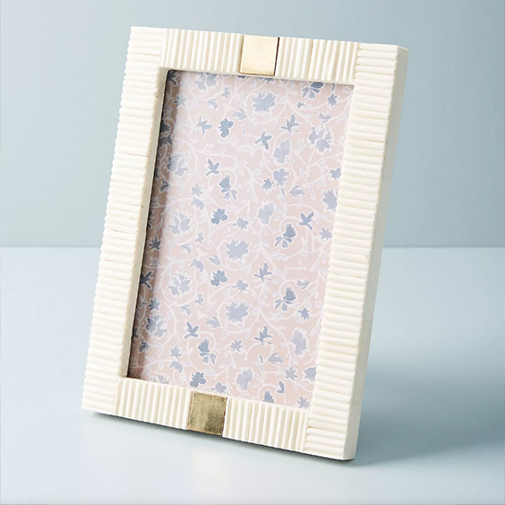 Bone-inlay picture frame holding a floral print