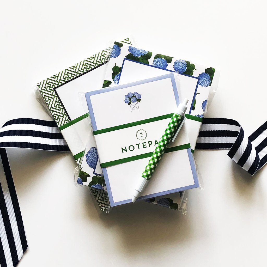Gift set of notepads and cards tied with striped ribbon