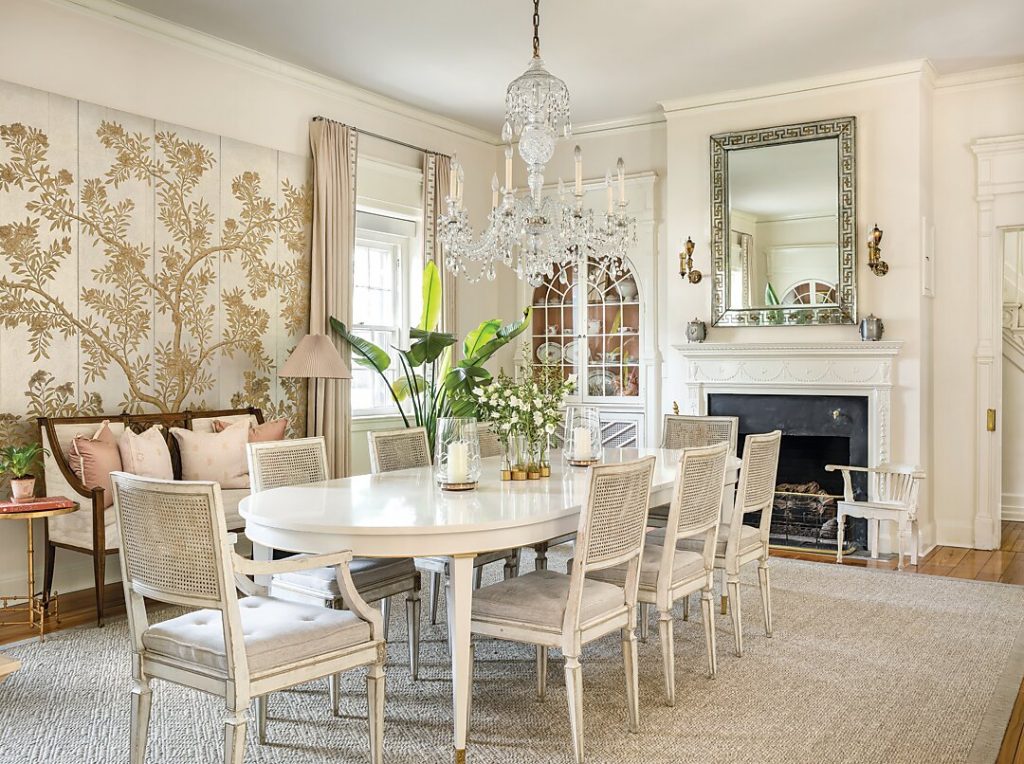 The home’s garden influence is, perhaps, most apparent in the dining room, where a pair of Gracie panels and a work by Hunt Slonem featuring butterflies invite nature indoors. Reclaimed cabinets and sconces that are replicas of ones at Mount Vernon give an air of history. In the kitchen, the lanterns over the island continue the garden flair.