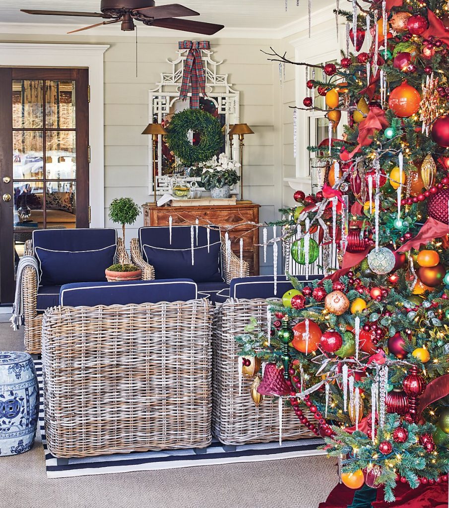 The den area plays into the season’s traditional reds and greens. As a rule, Bees never incorporates holiday décor that strays from the existing color palette of a room.