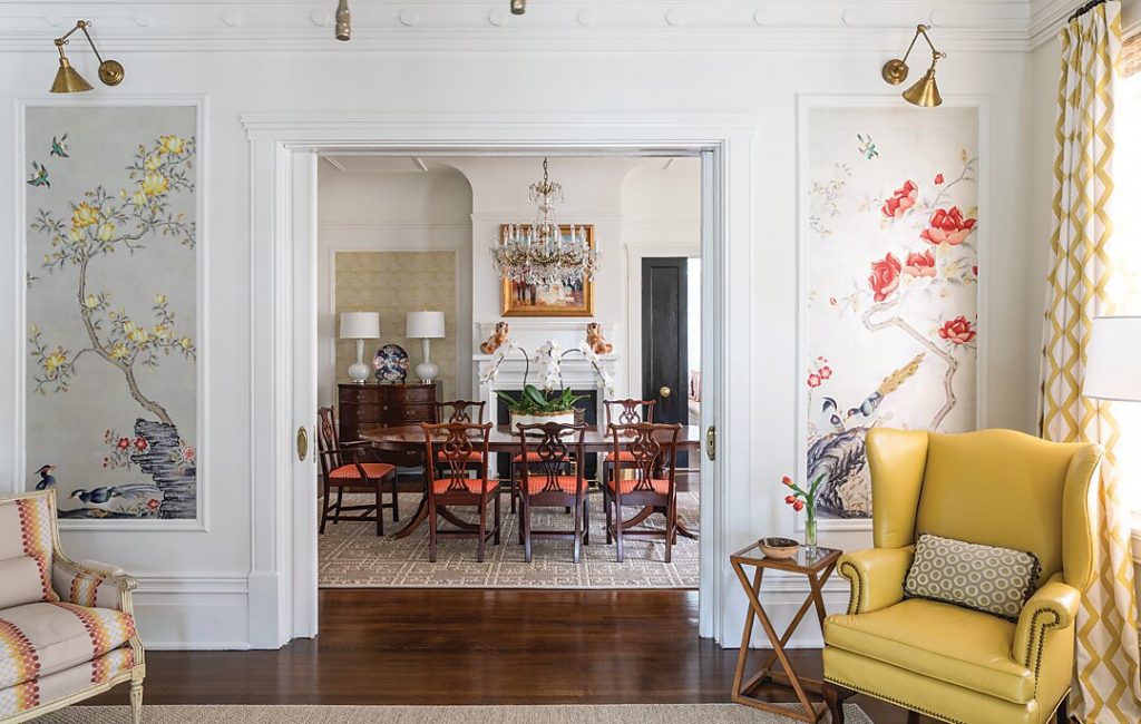 Not quite a room but not quite a foyer, the entry’s previous furniture plan clogged the space visually and functionally. Instead of floating the furniture in the center, Menge designed vignettes around the perimeter of the space and added hand-painted de Gournay panels to draw guests in toward the dining room.