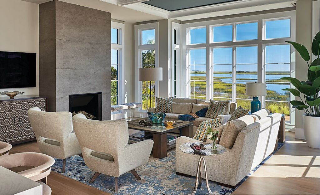 Subtle shades of blue and tan in the living room’s furnishings complement the view of the Wilmington sound.