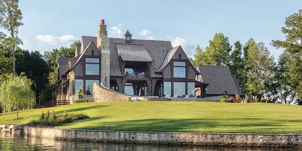 The rich wood siding, hand-selected cobbled stone, and a gently sloped cypress shake roof give Robin and Rod McSweeney’s home a fairy-tale feel