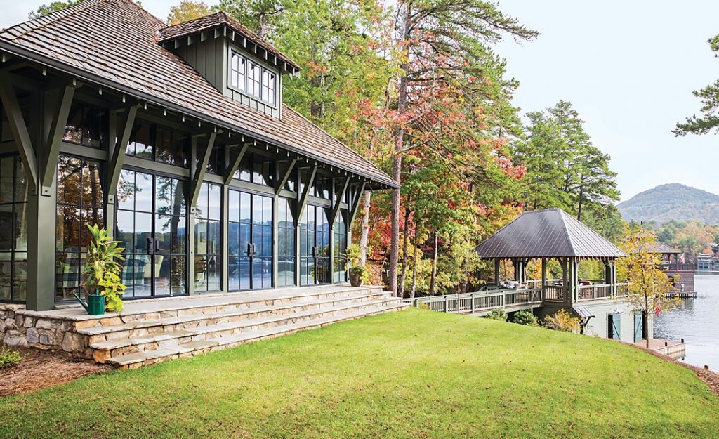 Windows and French doors overlook the lake on three sides.