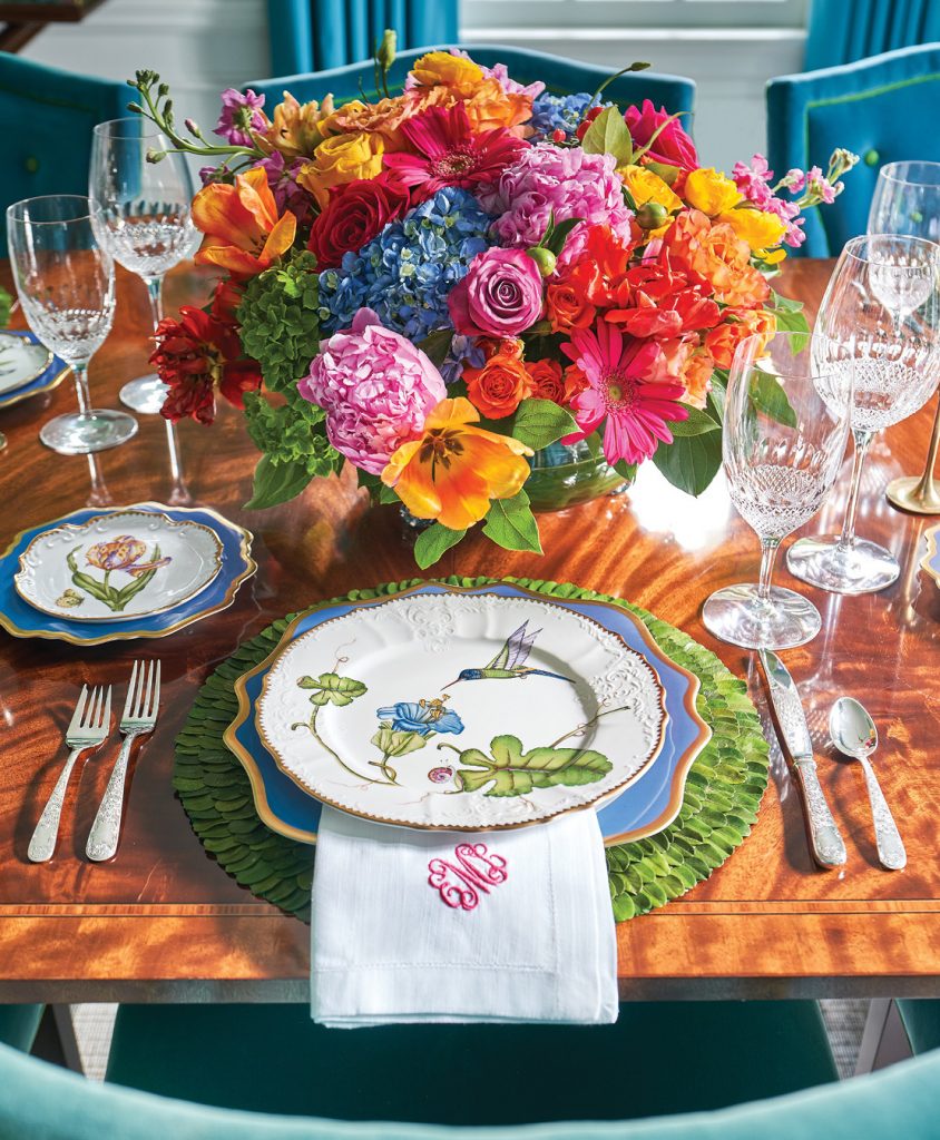 Table setting with a bright mixed bouquet and botanical china