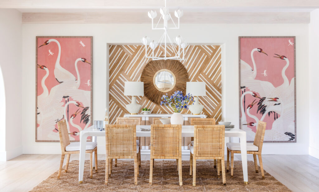 Dining room with pink flamingo panels and rattan chairs