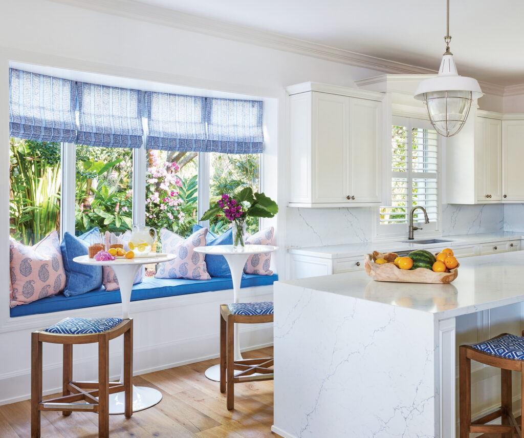 In the kitchen, Peterson and Hayes put a pair of bar-height tables in the breakfast nook to break up the horizontal mass of the island and counters.