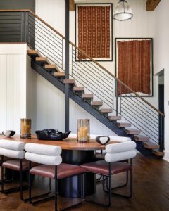 Wood-panelled study with a leather chair and a leaded window