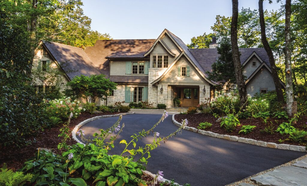 The architecture, led by Christopher Phelps, draws on classic French Country influences, balancing rustic charm with a sense of enduring elegance. Swooping rooflines, natural stone, and cedar shingles come together to create a home that feels both grounded and refined—timeless in its appeal and thoughtfully designed to age gracefully.