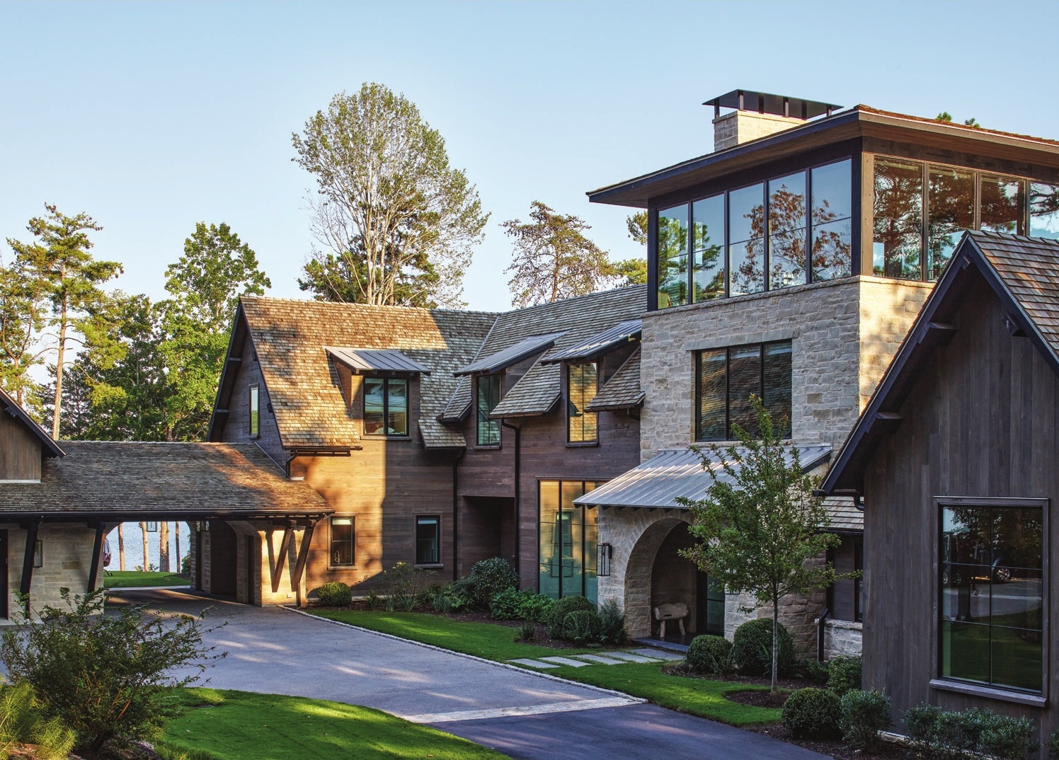 Designed by architect Brad Wright, the home’s exterior blends fluidly with the landscape, using natural materials, including cedar and zinc shingles and Lueders Buff honed and sealed limestone.