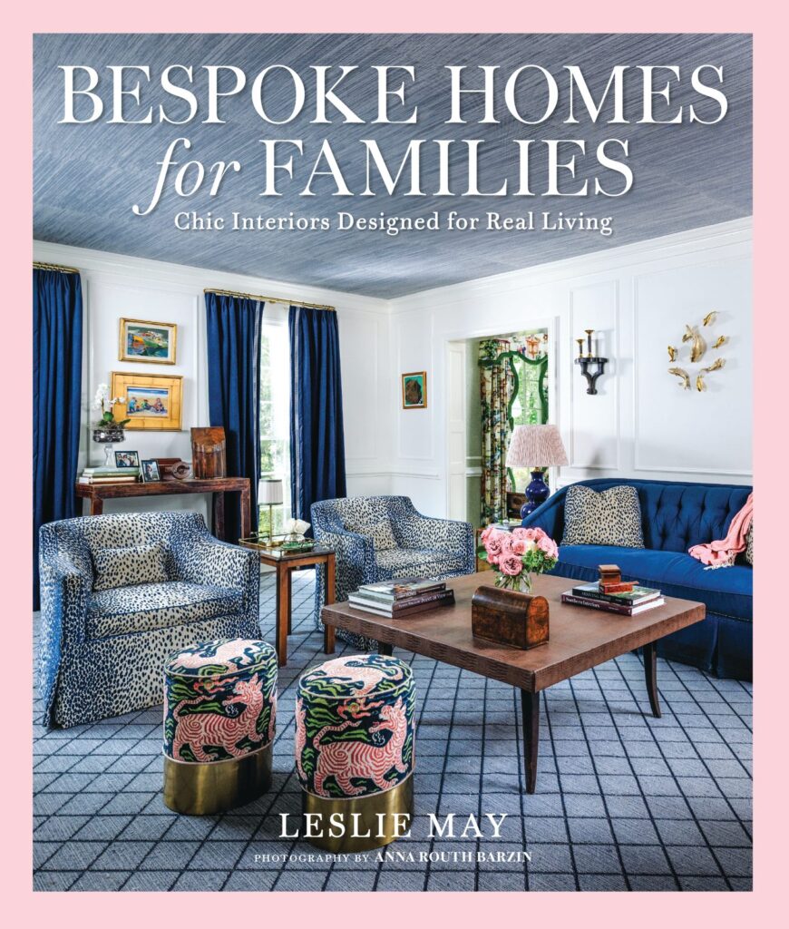 Cover of Bespoke Homes for Families by Leslie May, showing a living room with blue drapes, leopard-print chairs, and a navy lattice rug