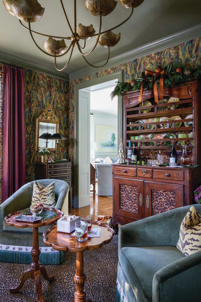 Cocktail lounge layered with marbleized wallcovering and tiger, tortoiseshell, and cheetah prints