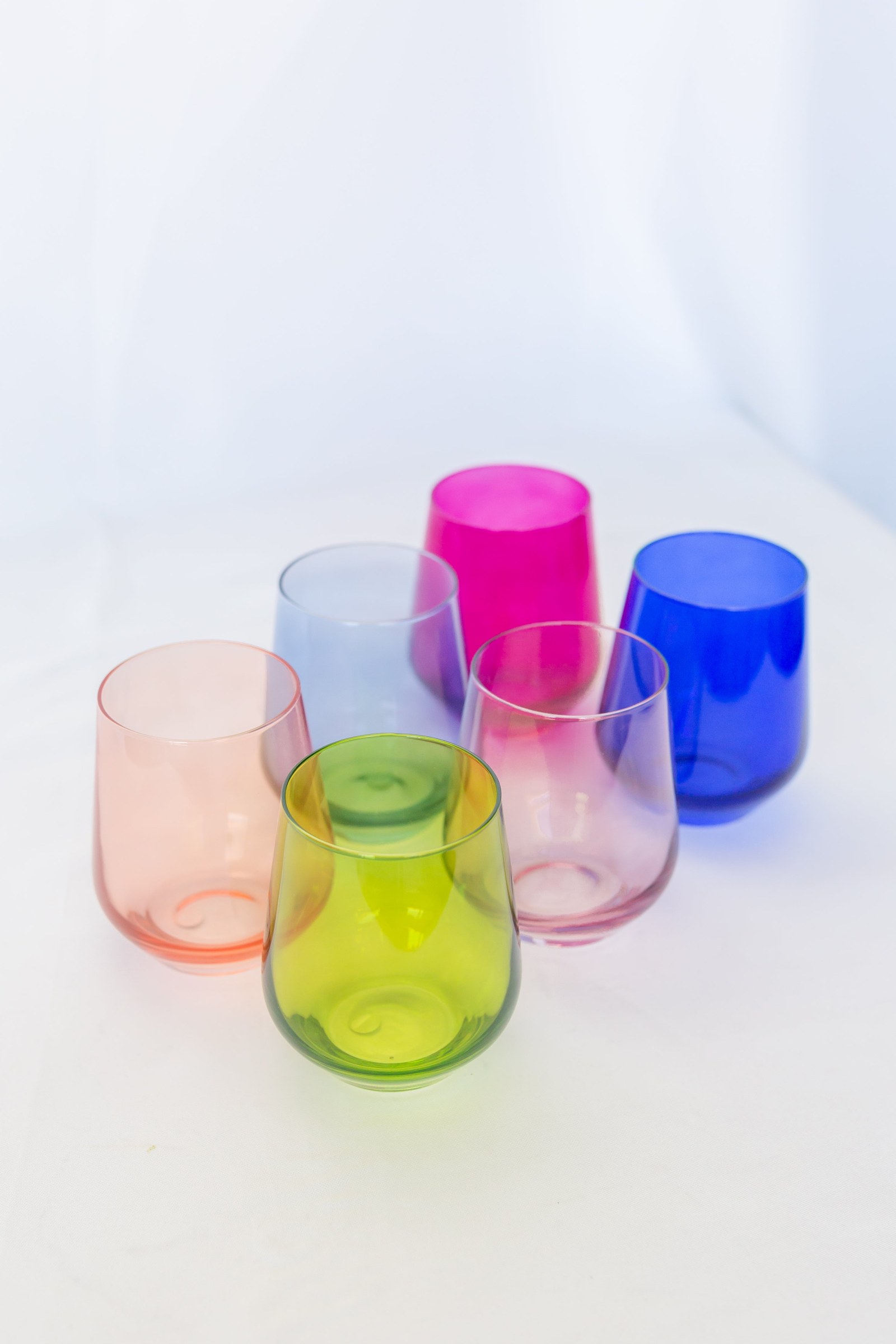Estelle Colored Glass stemless wine glasses in a mix of jewel tones