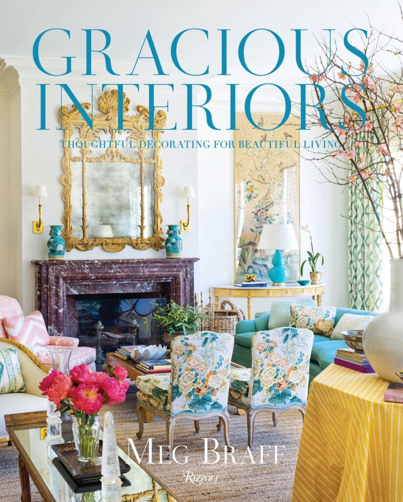 Cover of Gracious Interiors by Meg Braff, showing a living room with a gilt mirror, turquoise sofa, and floral chairs